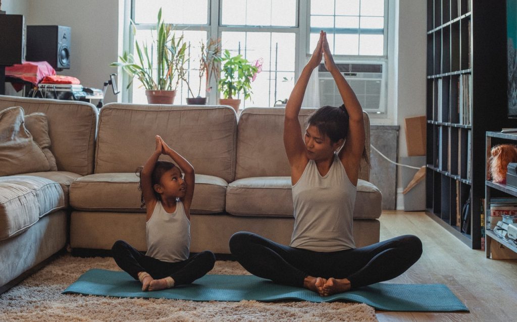 End the Battle of Bedtime: 10 Tips for Parents - Doing yoga to relax